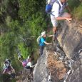 Ascending the rock pitch below Postern cave